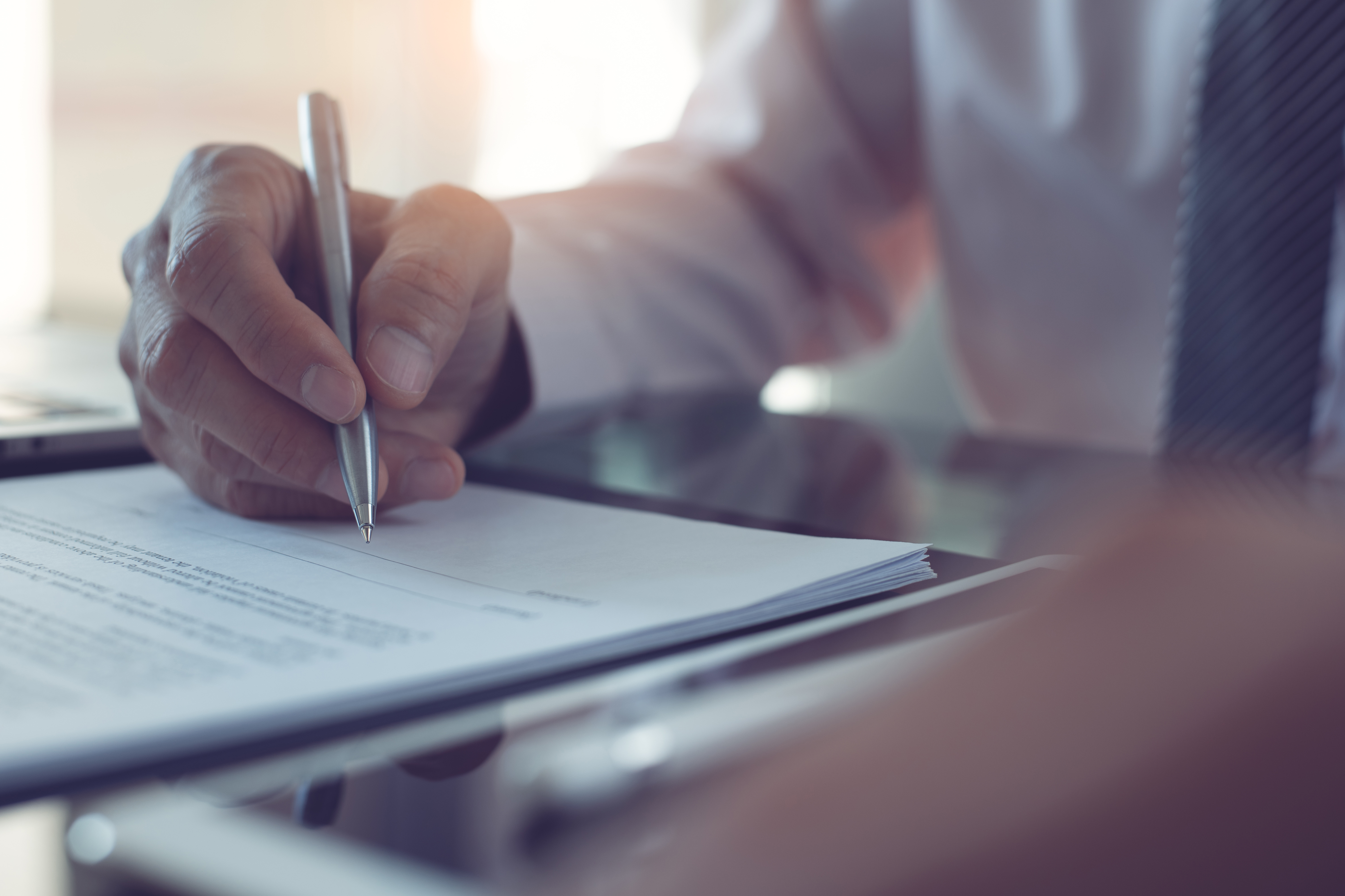 A foreigner signs an application for Spanish citizenship